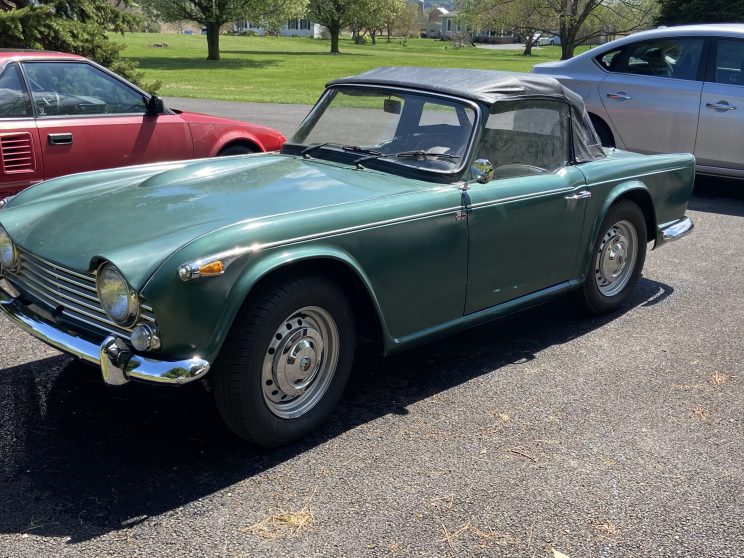 1967 Triumph TR4A as purchased, green with black top and disk wheels