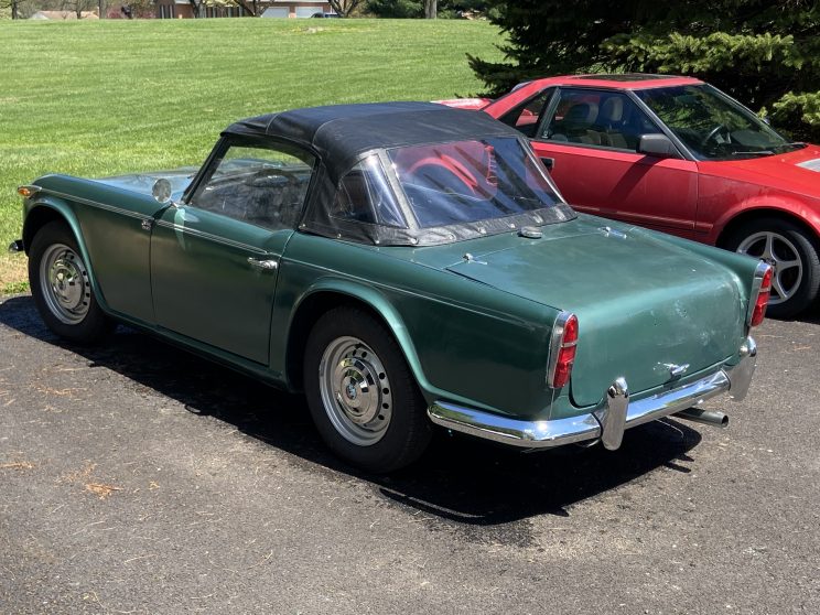 1967 Triumph TR4A rear view as purchased, green with black top